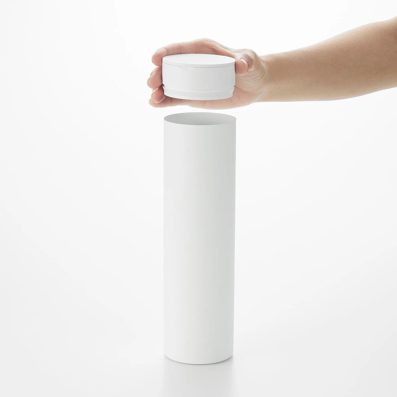 Tissue case tower with cylindrical lid