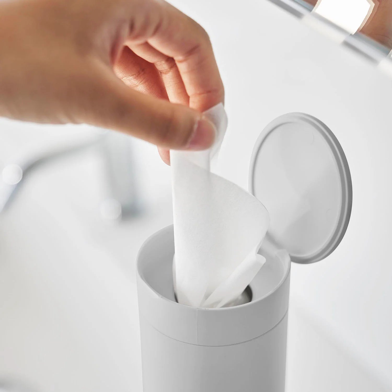 Tissue case tower with cylindrical lid