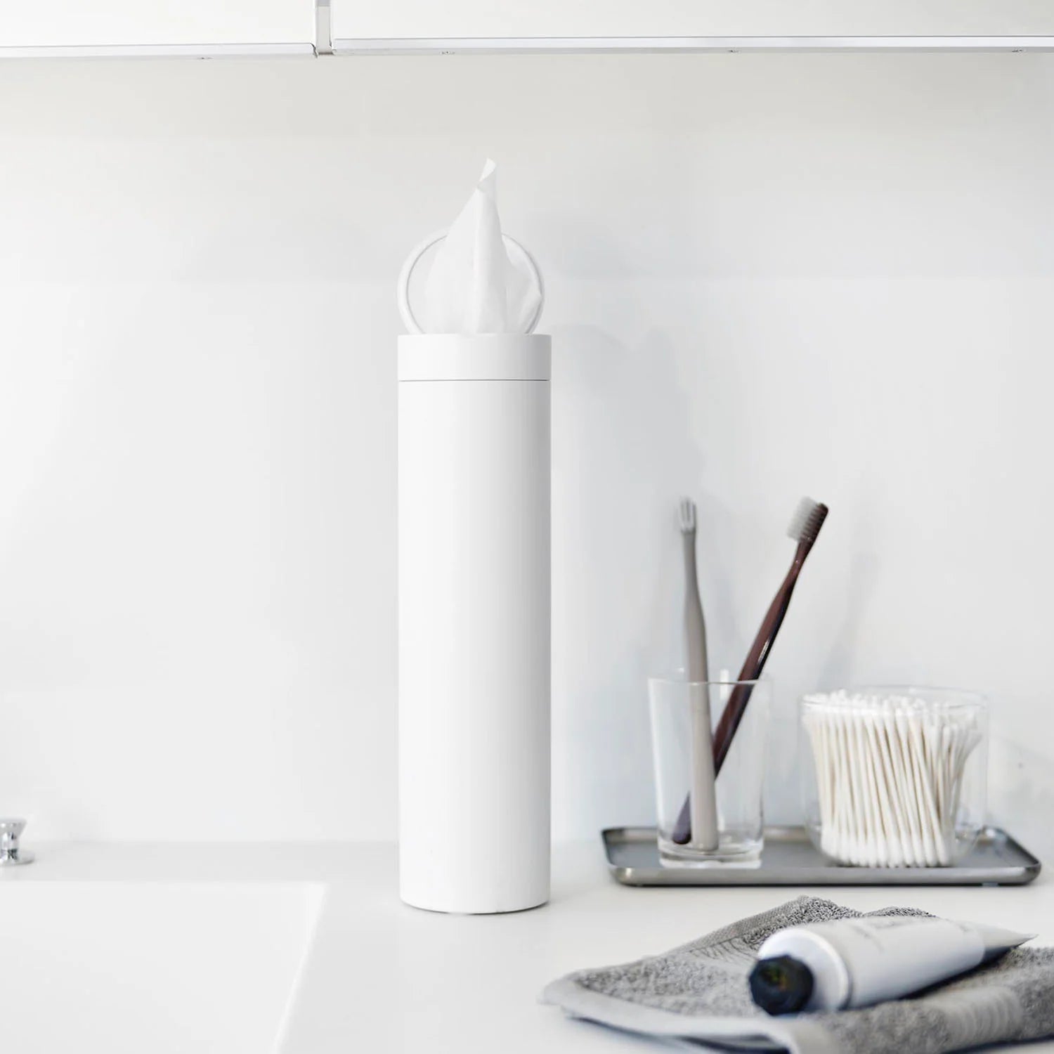 Tissue case tower with cylindrical lid