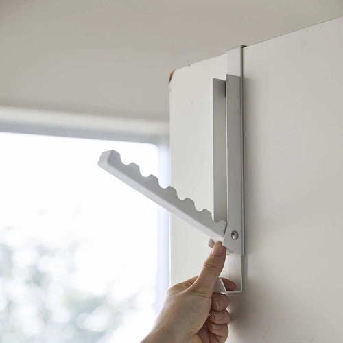 Folding door hanger tower